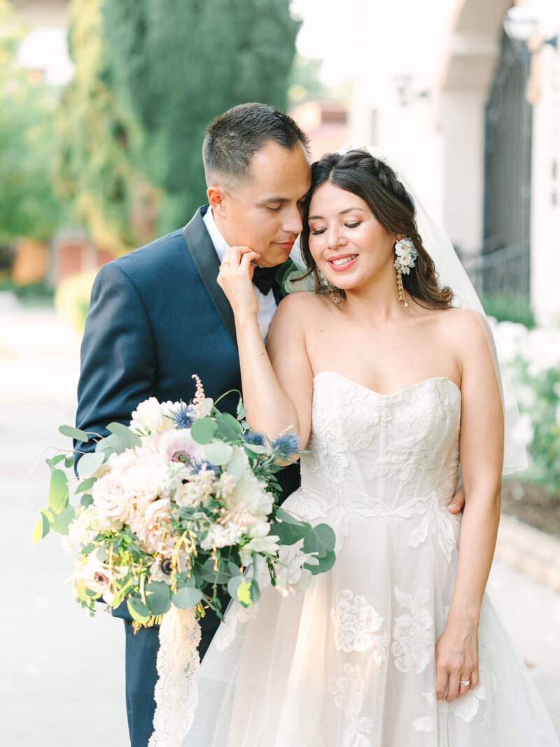 joyful wedding photography of bride and groom having a small dance
