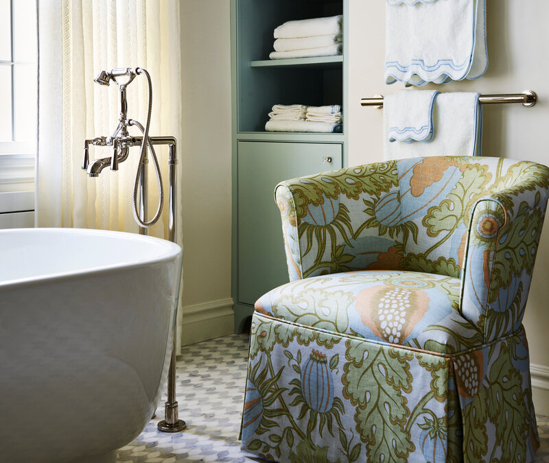 Best interior designers in Boston renovate a Milton bathroom with a Kallista tub and a Christopher Farr Cloth slipper chair for a refined classic look.