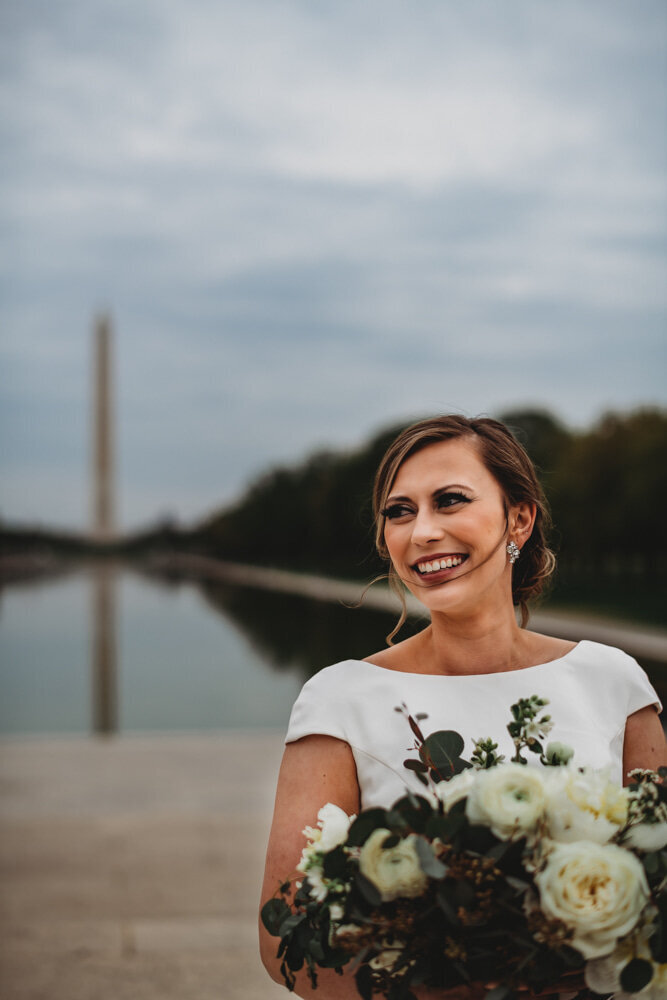 Baltimore wedding photographers captures elegant bridal portraits in Washington DC with bride in a satin wedding dress