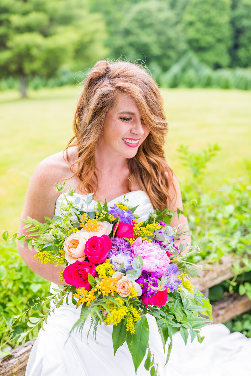 Bride poses on her wedding day at Lake Lure Inn and Spa by Tiffany McFalls.