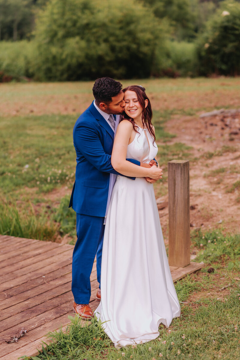 A couple hugs one another on their elopement day