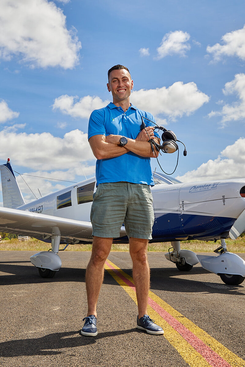 Commercial photography shoot at airport next to plane
