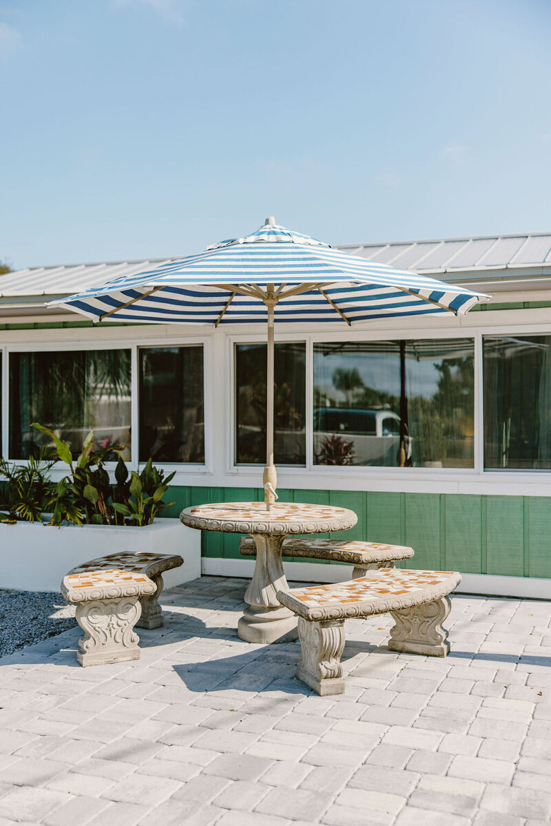 outdoor seating with table and umbrella