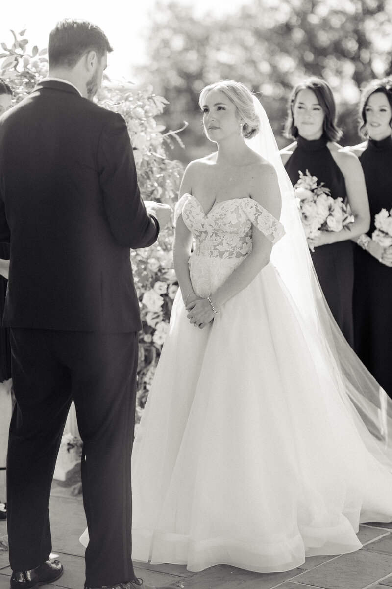 bride during her wedding hearing wedding vows