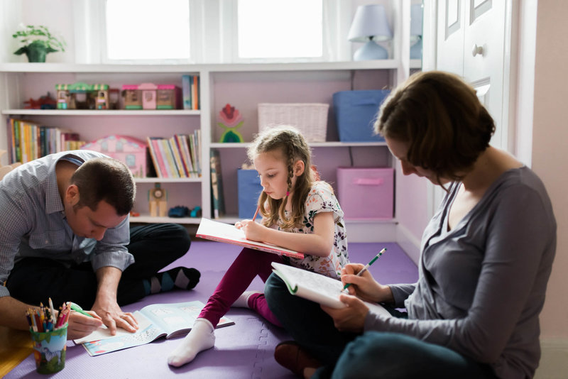 family coloring books in their home during lifestyle session