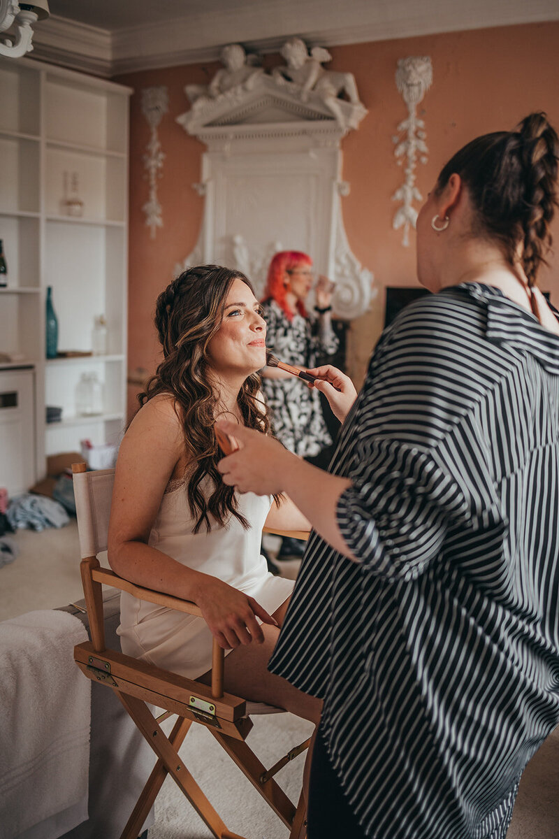 bride has her makeup done