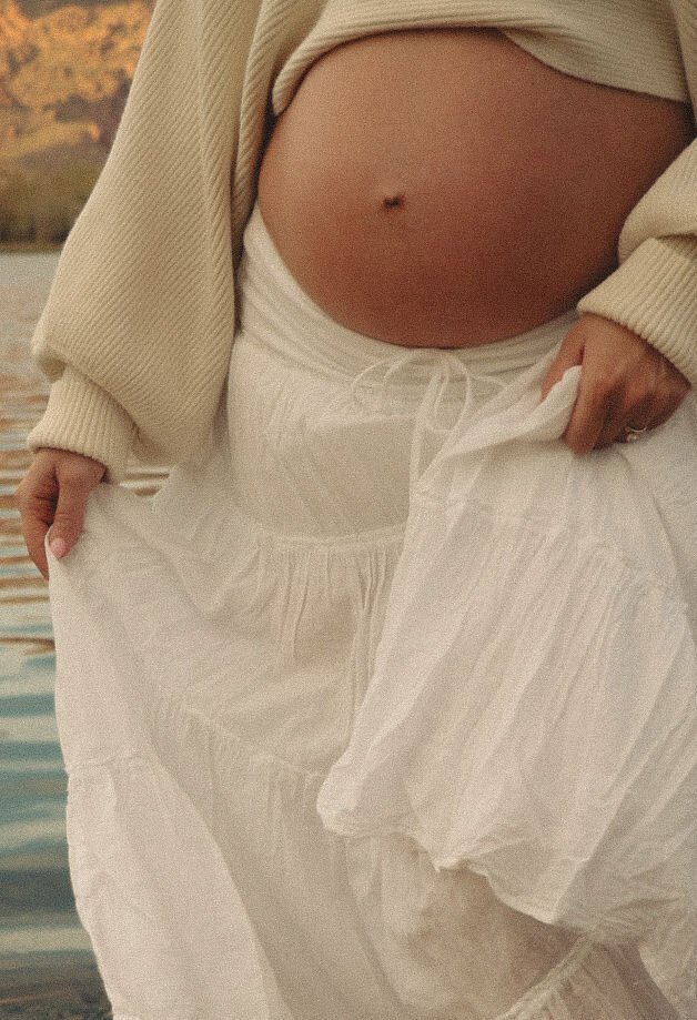 Authentic maternity photography in a sun-drenched water near Mesa, Arizona.
