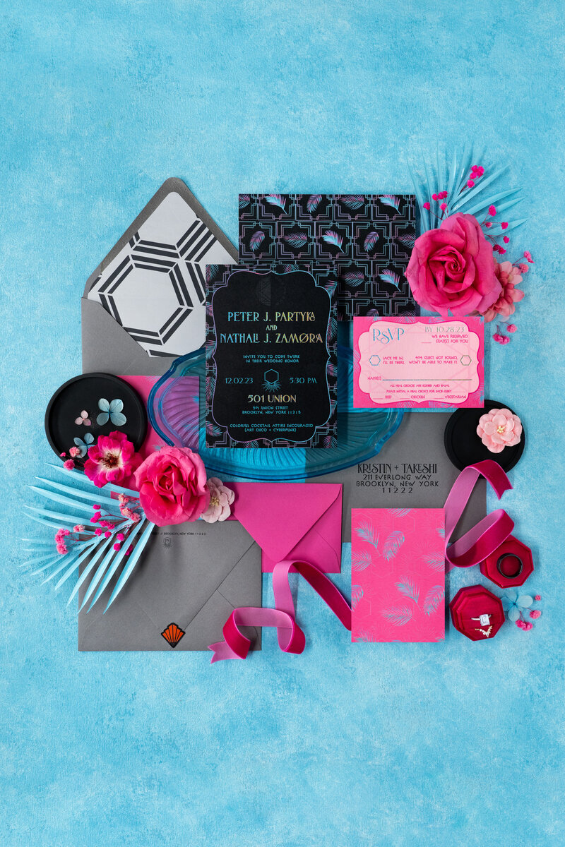 A retro themed wedding invitation suite with record place cards.