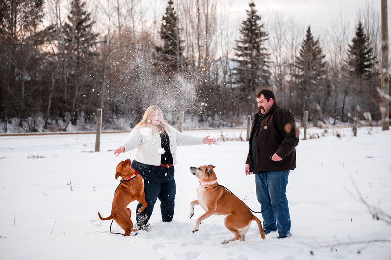 Family Photo of Edmonton Photographer and her husband and dogs in the mountains in Alberta