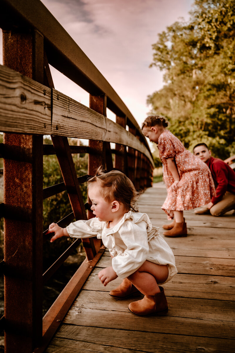 Eaton Rapids family looking over bridge