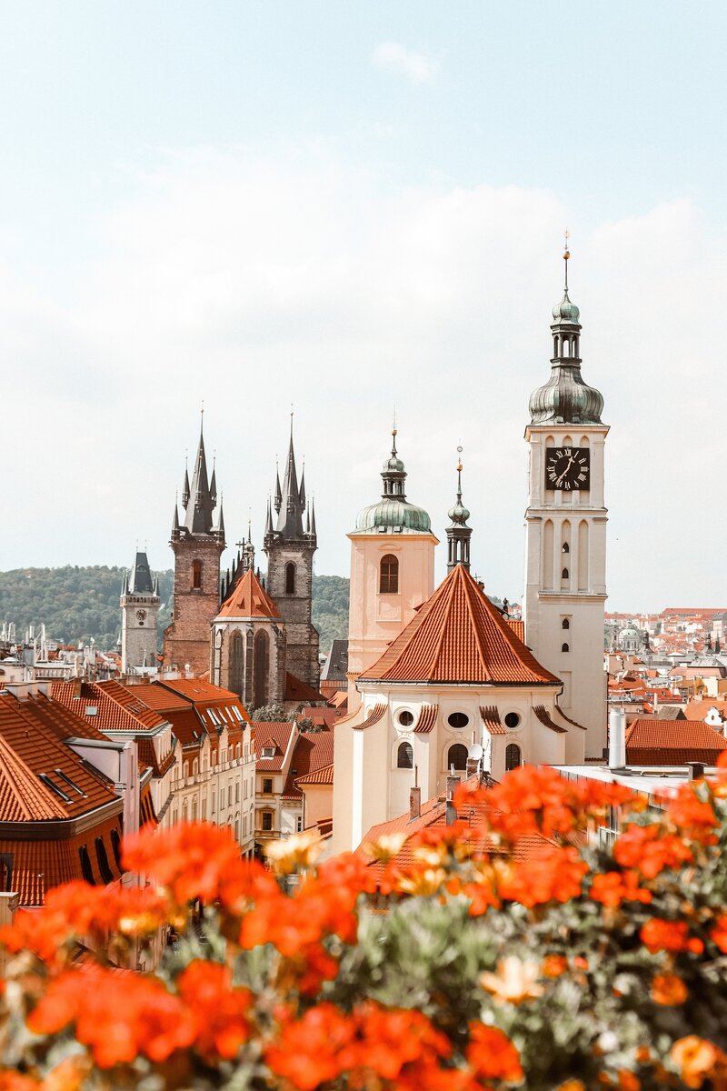 European architecture with stunning clock tower and gothic spires in Prague Czech Republic.