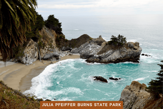 McWay Falls cascades onto the secluded beach at Julia Pfeiffer Burns State Park, surrounded by turquoise water and rugged cliffs.