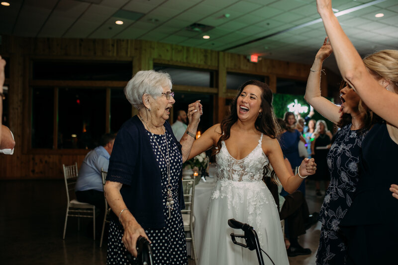 Bride dancing with grandma at wedding reception at  Solitude Links Golf Course.