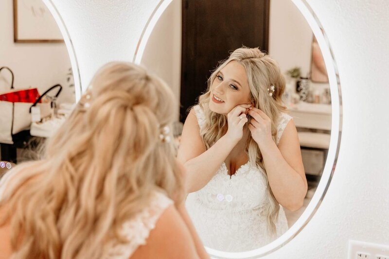 Bride getting ready for her wedding day after a custom bridal spray tan at Boho Glow Studio in Mankato, MN.