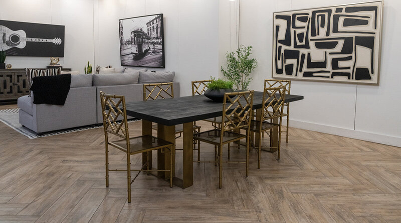 occupied after photo - black and gold dining table with gold chairs and centerpiece