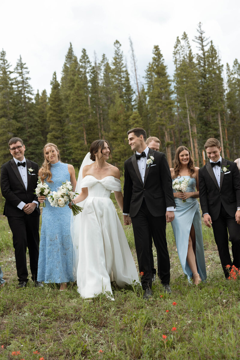 bride looks over her shoulder at the camera