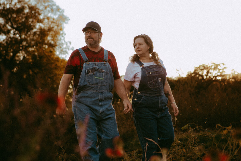 Couple standing looking over their garden