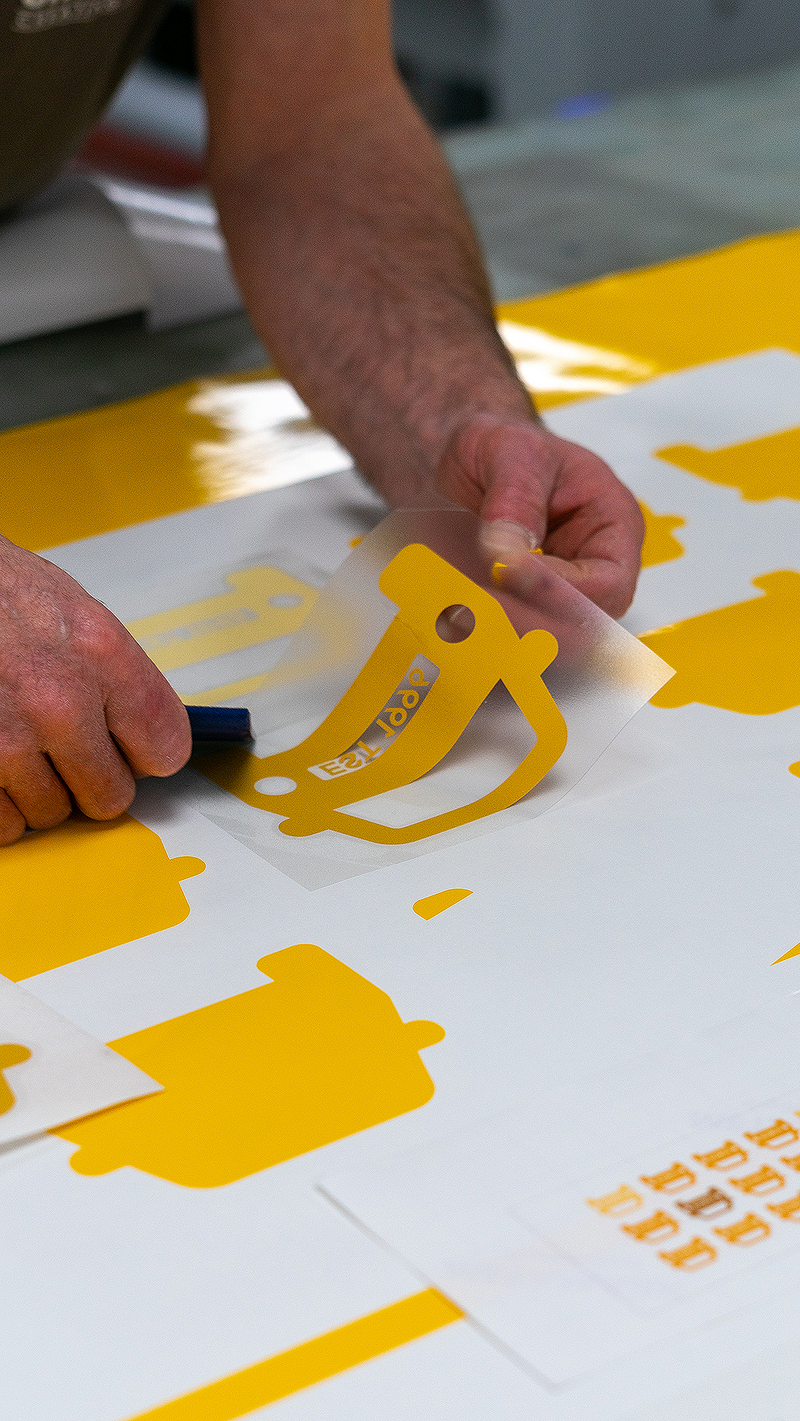 Vinyl application to projecting sign