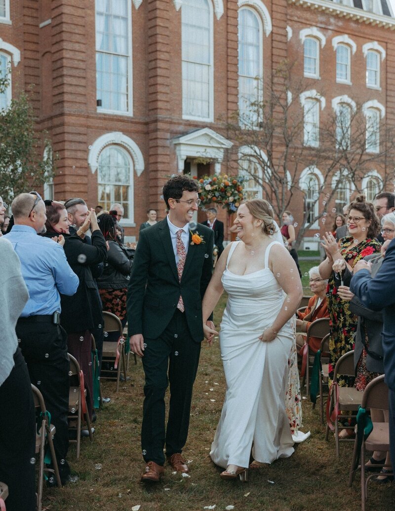 bride and groom just married at their vermont wedding ceremony captured by vermont wedding photographer elsie goodman