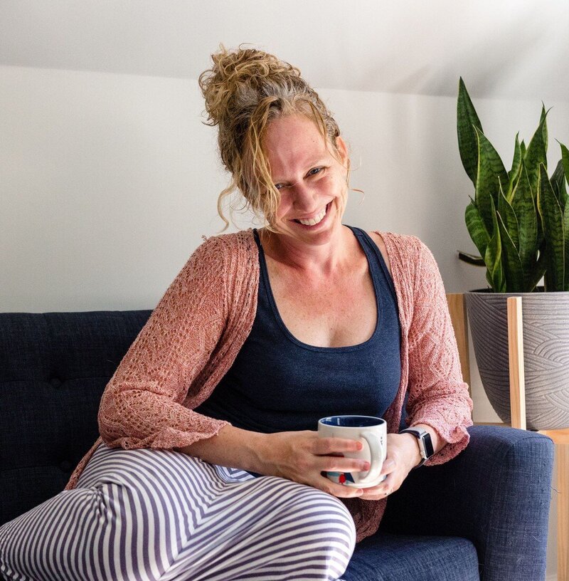 Kelly Loss sits in her home in Alexandria, Virginia with a cup of tea in hand 