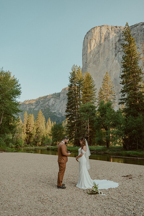 bride and groom exchanging vows at cathedral beach in yosemite valley