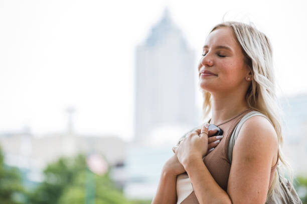 woman soaking in the sun on her face