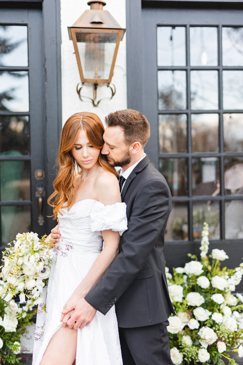 Wedding couple at estate wedding venue in Eagle Idaho photographed by Miranda Renee Photography in attire from A&Be Bridal with florals from Wild Alpine Floral based in Nampa Idaho