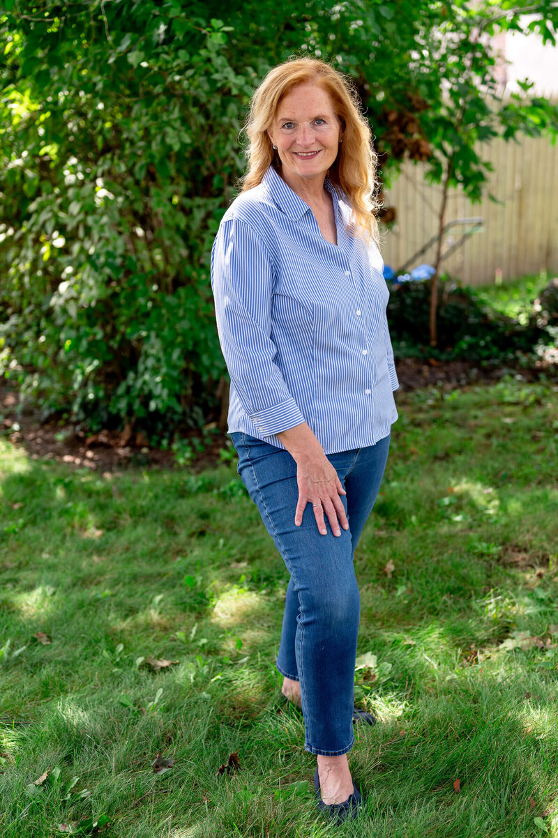 Blonde woman standing confidently outside, posing for headshot for a Greenwich town elected position campaign images .