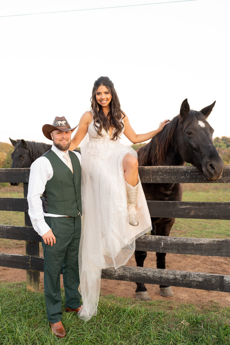 Bride and groom posing with a horse after hiking a mountain for elopement pictures.