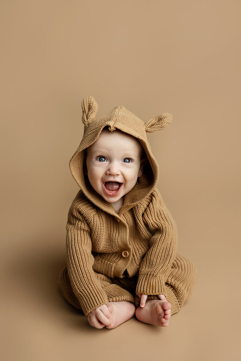 Six month old baby boy with the cutest smile in a Fort Collins studio