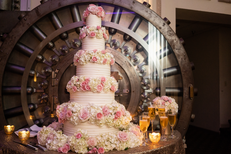 A pink and white wedding cake