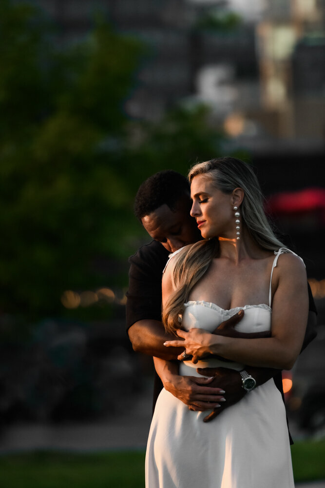 bride groom embrace in golden hour light