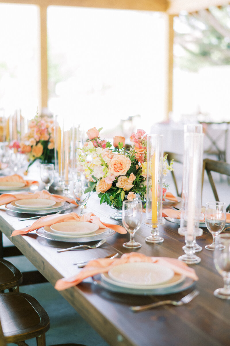Beautifully curated wedding reception table with soft peach napkins, delicate glassware, and romantic pastel florals. An intimate and thoughtfully designed celebration by Grace-Filled Gathering Co.