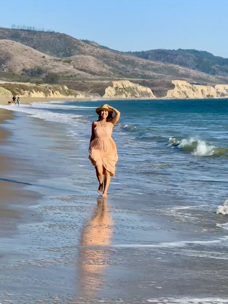 woman walking on beach in CA