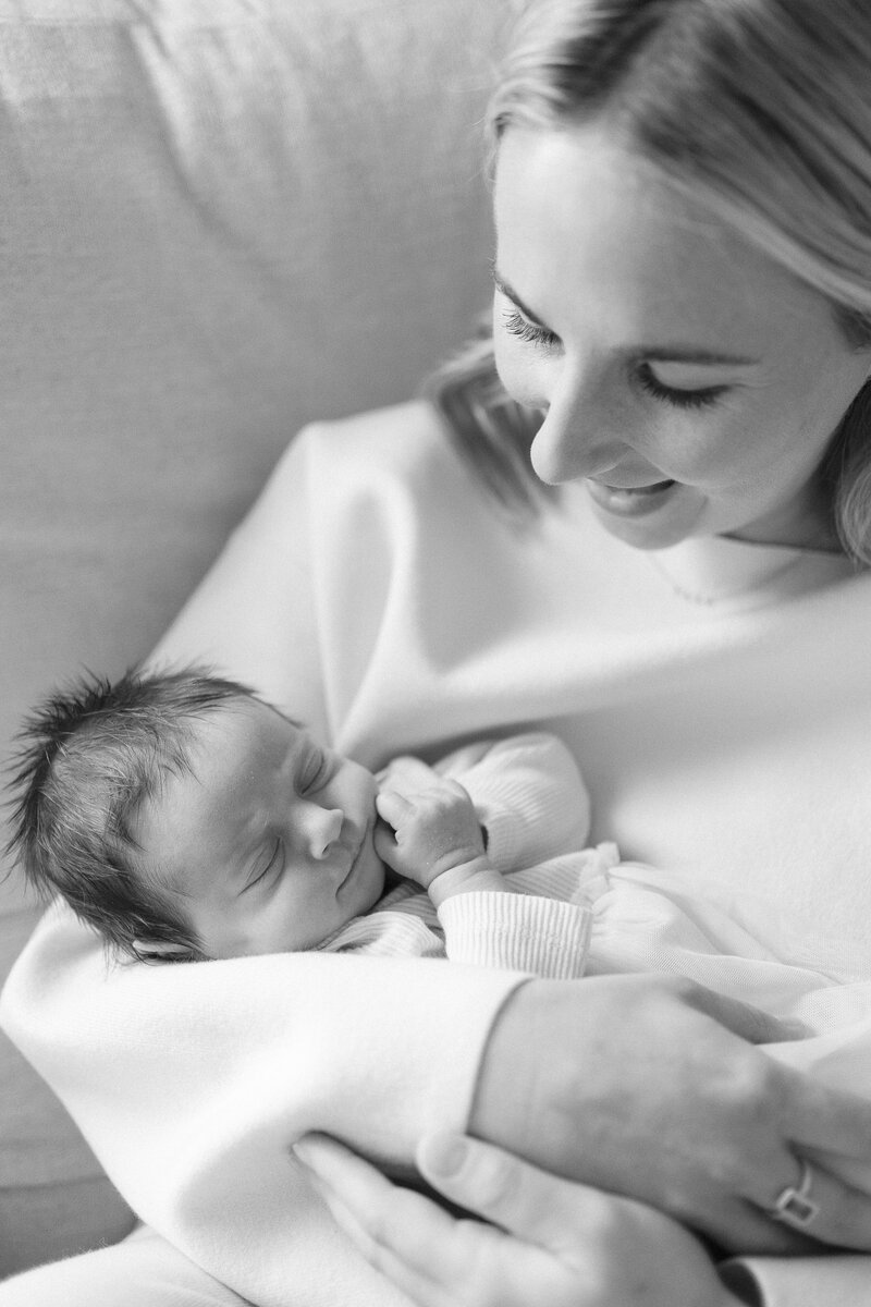 black and white photo of mom holding baby