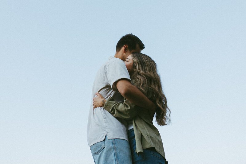 couple hug  at their Fernie photo session