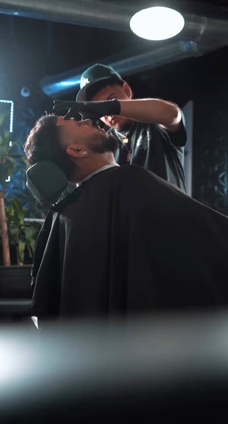 A barber giving a modern classic fade haircut at Onyx Barbershop in Wildomar / Temecula / Murrieta area of California.