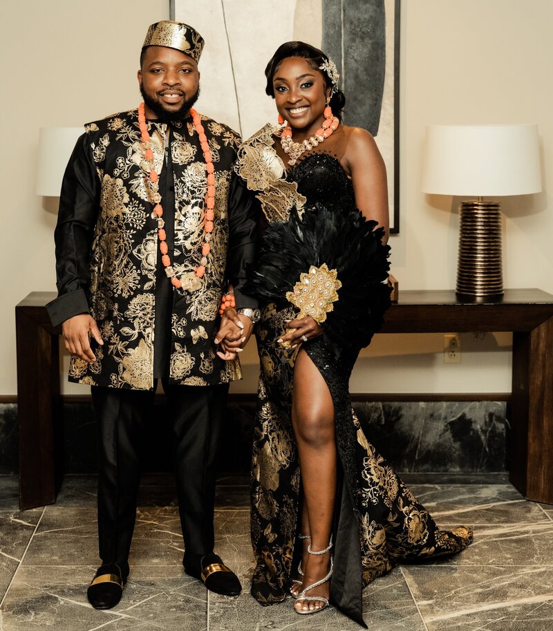 Nigerian wedding couple poses in traditional attire
