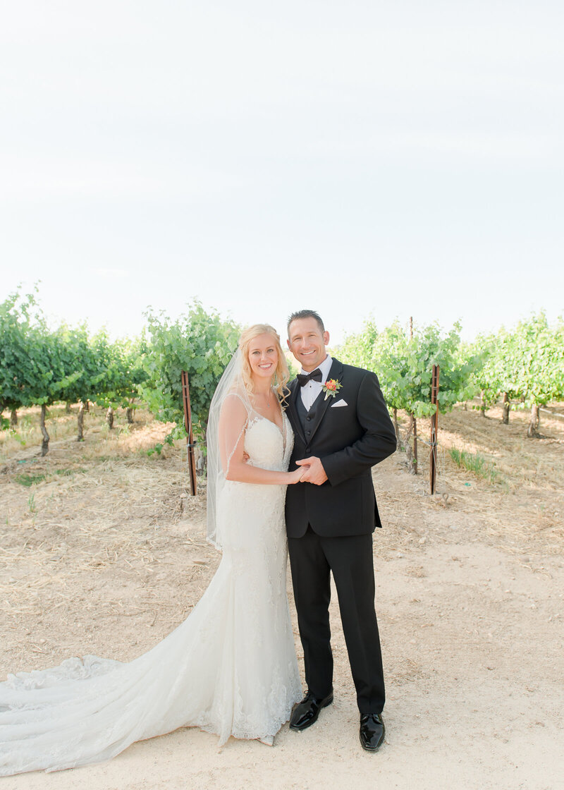 wedding couple looking at the camera at their monterey wedding reception