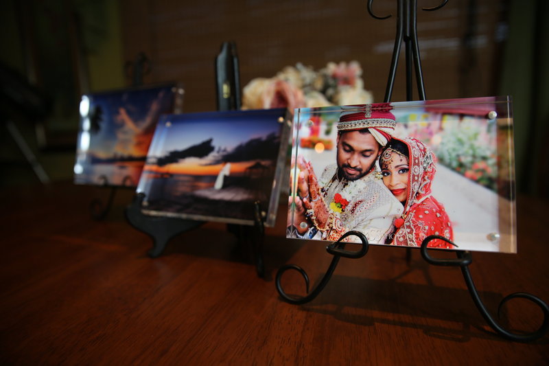 Photos in glass block frames on decorative easels. By Ross Photography, Trinidad, W.I..