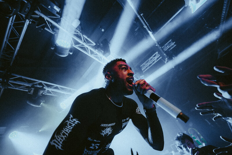 Big special lead singer sings in front of cheering crowd