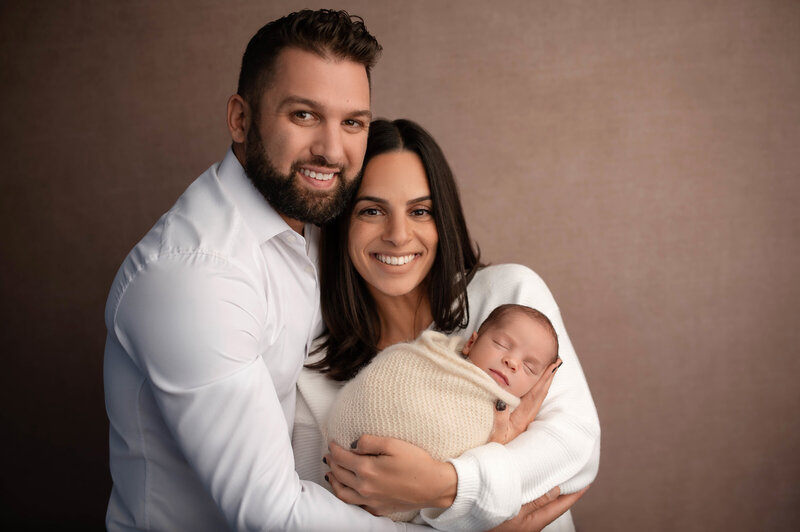Fairfield CT newborn photographer captures new family of three with their little newborn baby boy at Connecticut