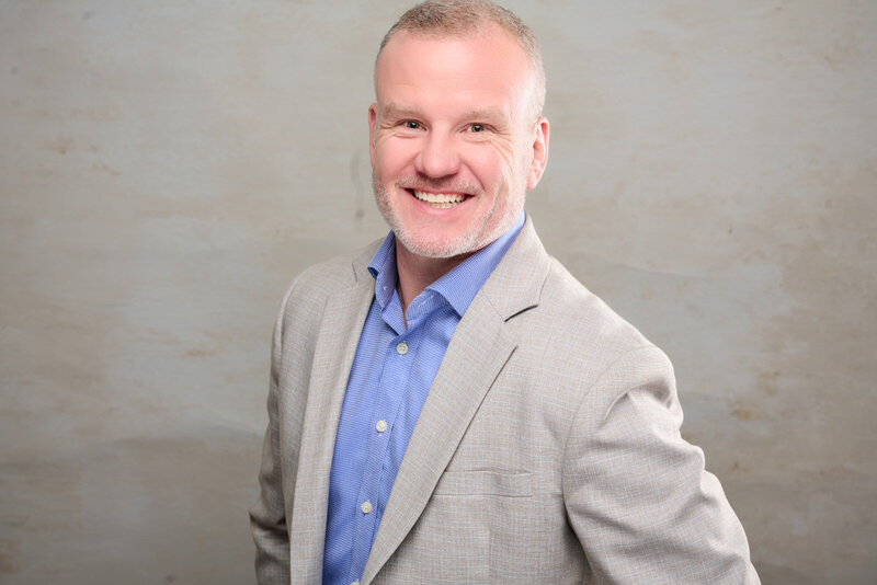 Professional Headshot Photographer in Minneapolis Captures Friendly Business Executive-100