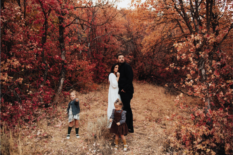 family-in-woods-with-pretty-leaves