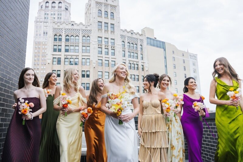 Bridal party in multicolored dresses at downtown Detroit wedding