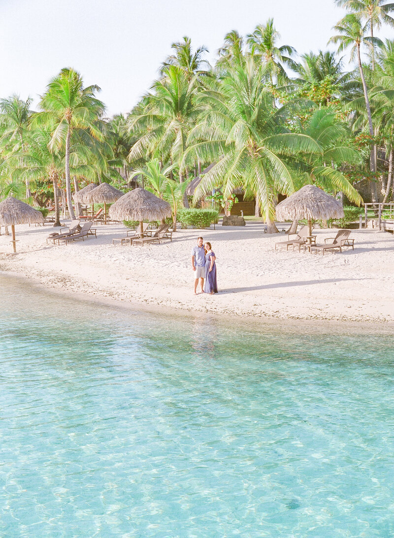 Aerial view Intercontinental Bora Bora couple on the beach