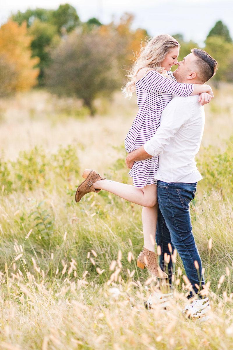 Couple celebrate their engagement during their Austin engagement session. Photo taken by Austin Engagement Photographers, Joanna & Brett Photography