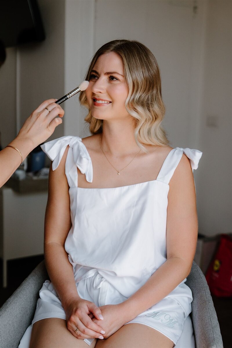 elegant bride in queenstown for wedding with hair and makeup sleek and natural