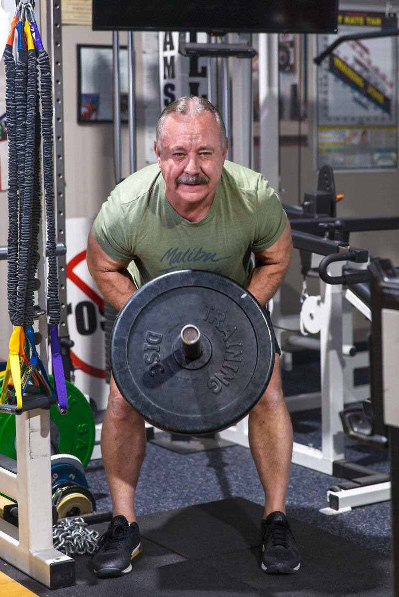Coach Doug Briggs of El Paso, TX performing a strength training activity 