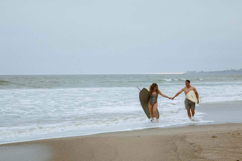 Couple surfing photoshoot in  Ventura California